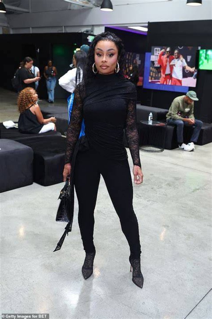 Blac Chyna Strikes a Pose in Fashion Nova Orange Cargo Short Set